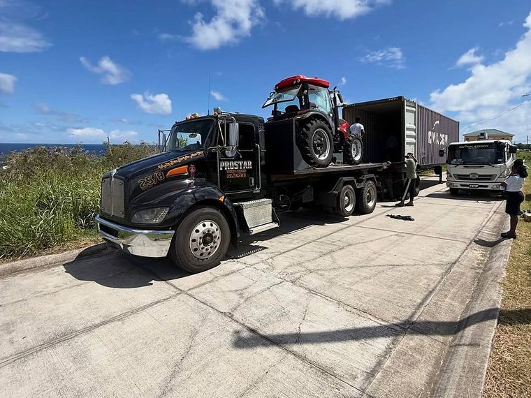 The ProStar Kenworth flatbed with 25/8 on the hood