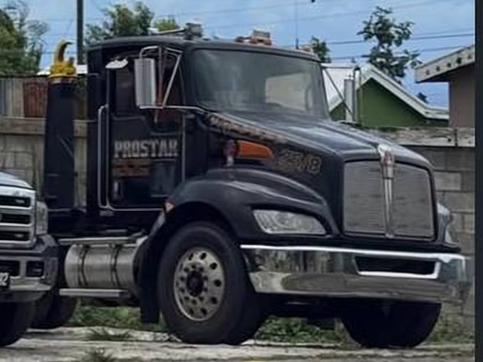 A black ProStar Kenworth truck